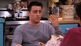 Joey (Matt LeBlanc) looks at his sweaty hand on an episode of Friends.