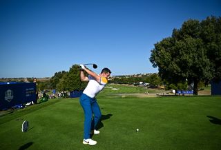 Rory McIlroy hits a drive in Ryder Cup practice