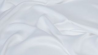 Close up of white bed sheets
