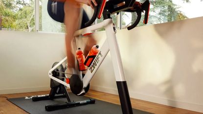 The Zwift Ride smart trainer set up and being ridden indoors
