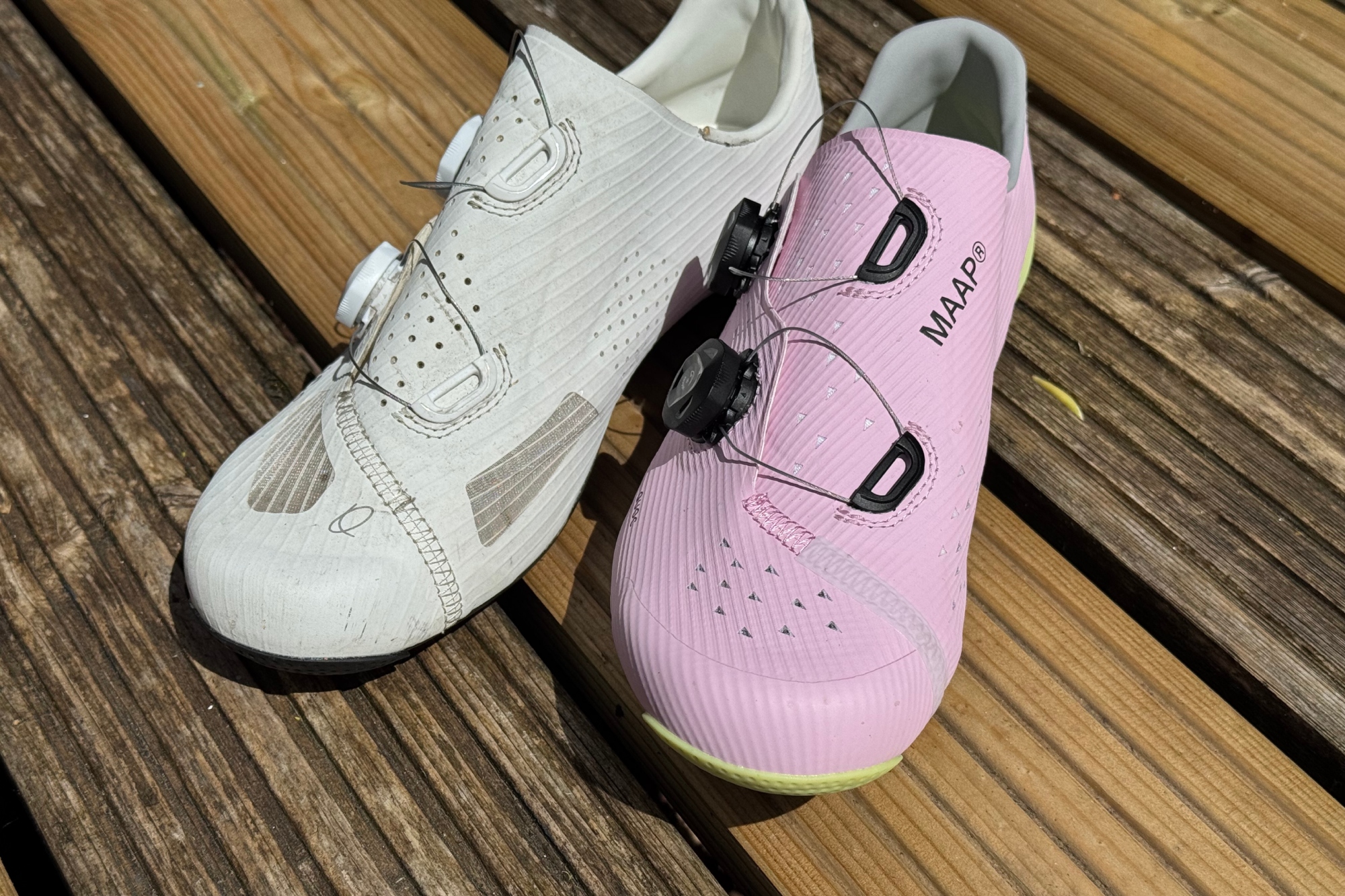 The pink MAAP x QUOC M3 shoe shown next to a white QUOC M3 shoe