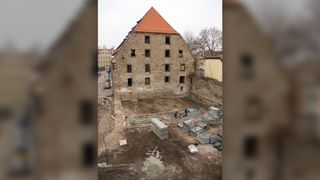 The granary built on top of the medieval Jewish cemetery was redeveloped in 2013 into a multistory car garage; the graves were unearthed by an archaeological rescue excavation before construction went ahead.