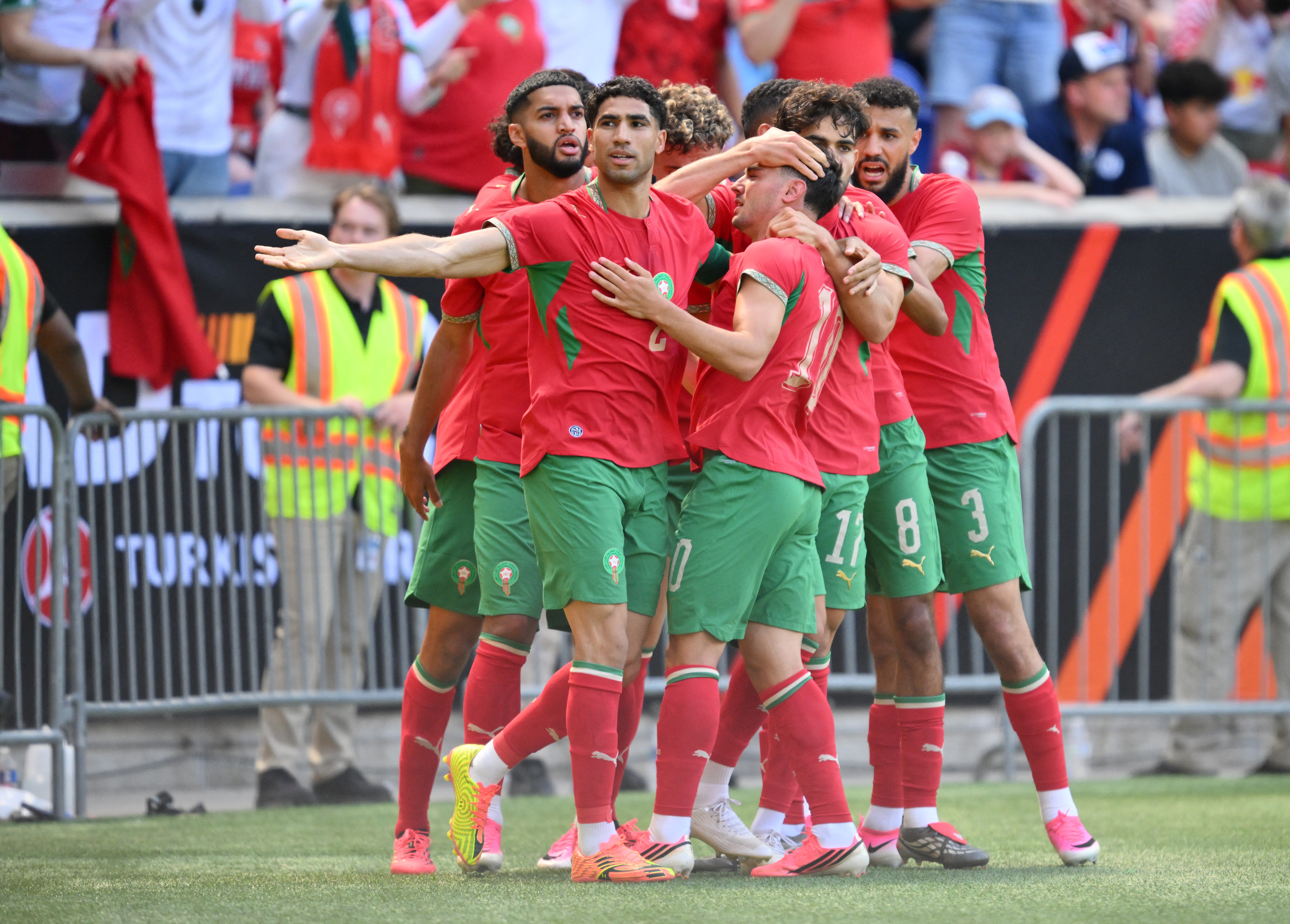Morocco's defender #02 Achraf Hakimi (2nd L) celebrates with teammates after Morocco scored during the international friendly football match between Morocco and Norway at Sports Illustrated Stadium in Harrison, New Jersey, on June 7, 2026. (Photo by ANGELA WEISS / AFP)