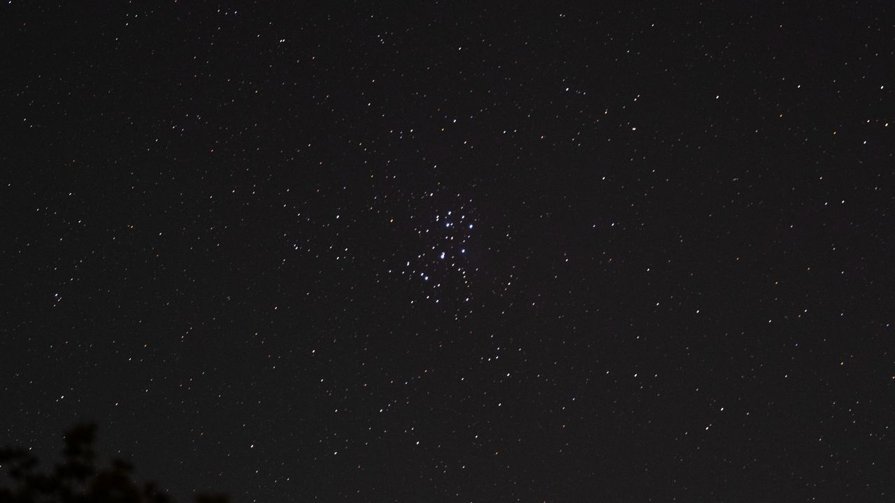 The Pleiades star cluster in the starry night sky, as photographed by the Fujifilm GFX100S II.