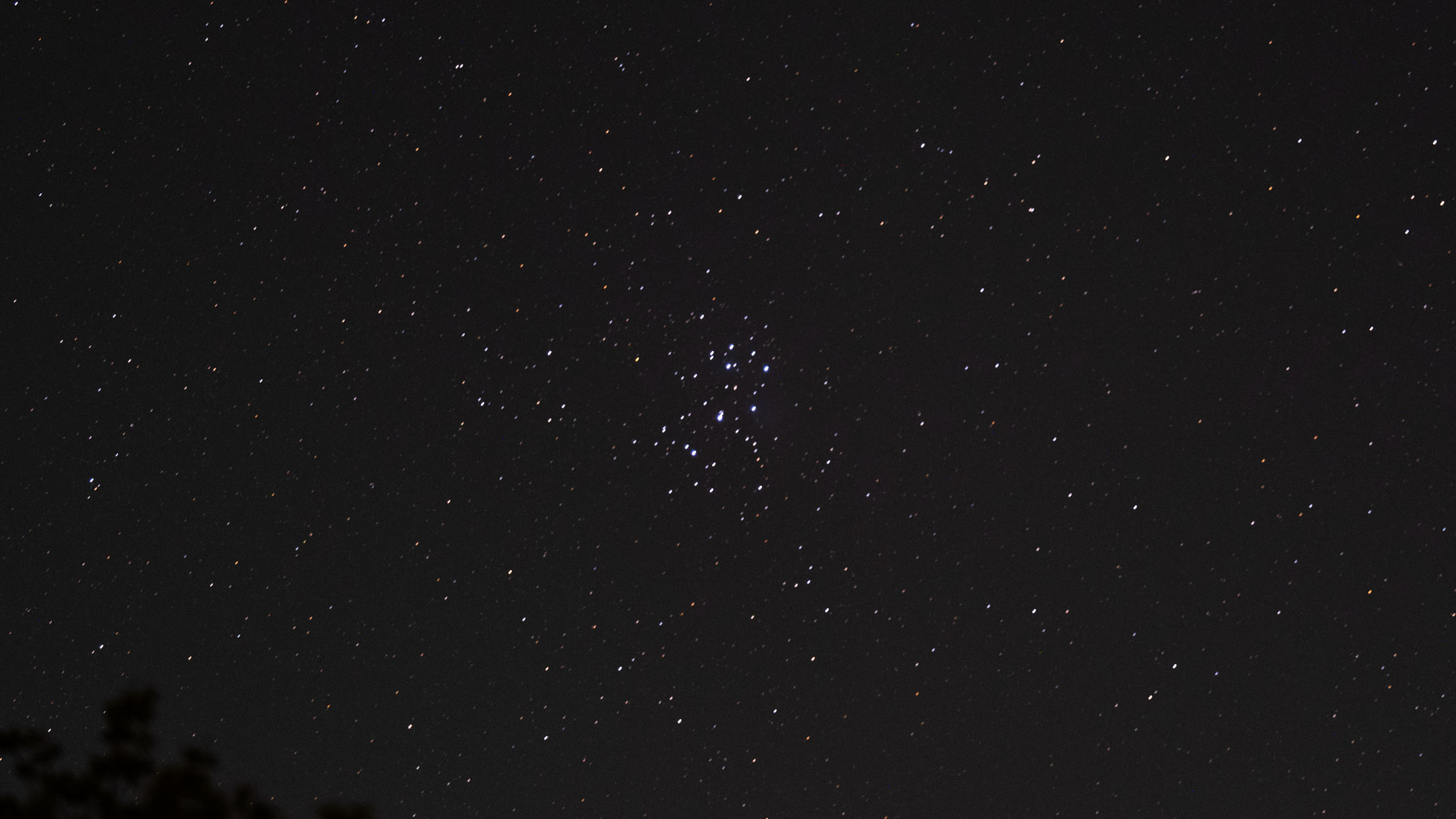 The Pleiades star cluster in the starry night sky, as photographed by the Fujifilm GFX100S II.