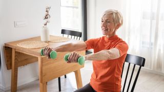 a photo of a senior woman doing exercises in a chair