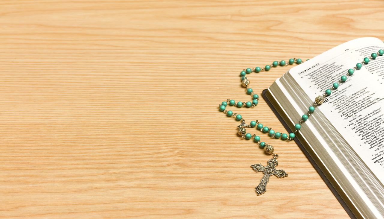 Rosary on Bible