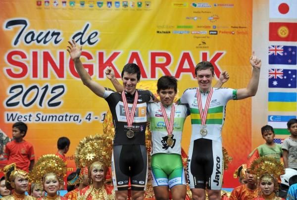 Stage two winners of Tour de Singkarak 2012, Alexander Smyth in third place (Plan B Racing Team Australia-left), Shih Hsin Hsiao is the winner (Action Cycling Team Taiwan-centre), and Alexander Edmonson in second place (Australian National Team-right).