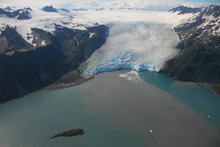 An aerial view of the front of Aialik Glacier flowing from the Harding Icefield on the Kenai Peninsula in Alaska.