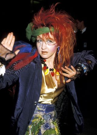 Cyndi Lauper enjoying a flurry of fabrics and colours in a unique outfit combo