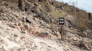 Trail sign on a steep, rugged part of the trail on Camelback mountain