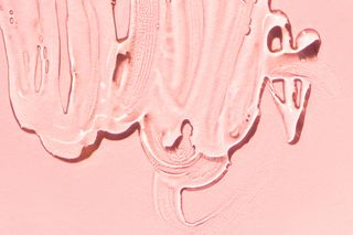 Close-up top view of clean gel for skin care procedure smeared on pink background. Trendy products of the year (Close-up top view of clean gel for skin care procedure smeared on pink background. Trendy products of the year, ASCII, 112 components, 112