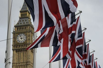 Union Jack flags flying near the Big Ben in London
