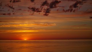 Sunsets often appear red because of the angle of the sun. At such a low position in the sky, the sun sends the longer-wavelength red light right to your line of sight.