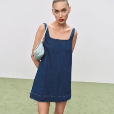 Elsa Hosk wearing a denim Reformation dress