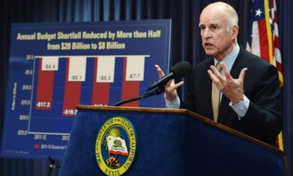 Gov. Jerry Brown (D) will attempt to tackle California's crippling budget shortfall by slashing social services and limiting state workers to a four-day week.