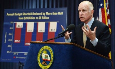 Gov. Jerry Brown (D) will attempt to tackle California&amp;#039;s crippling budget shortfall by slashing social services and limiting state workers to a four-day week.