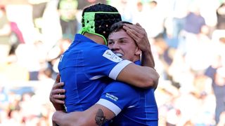 Alessandro Garbisi of Italy hugs his teammate ahead of the Ireland vs Italy Six Nations 2024 round two match in Dublin, Ireland.