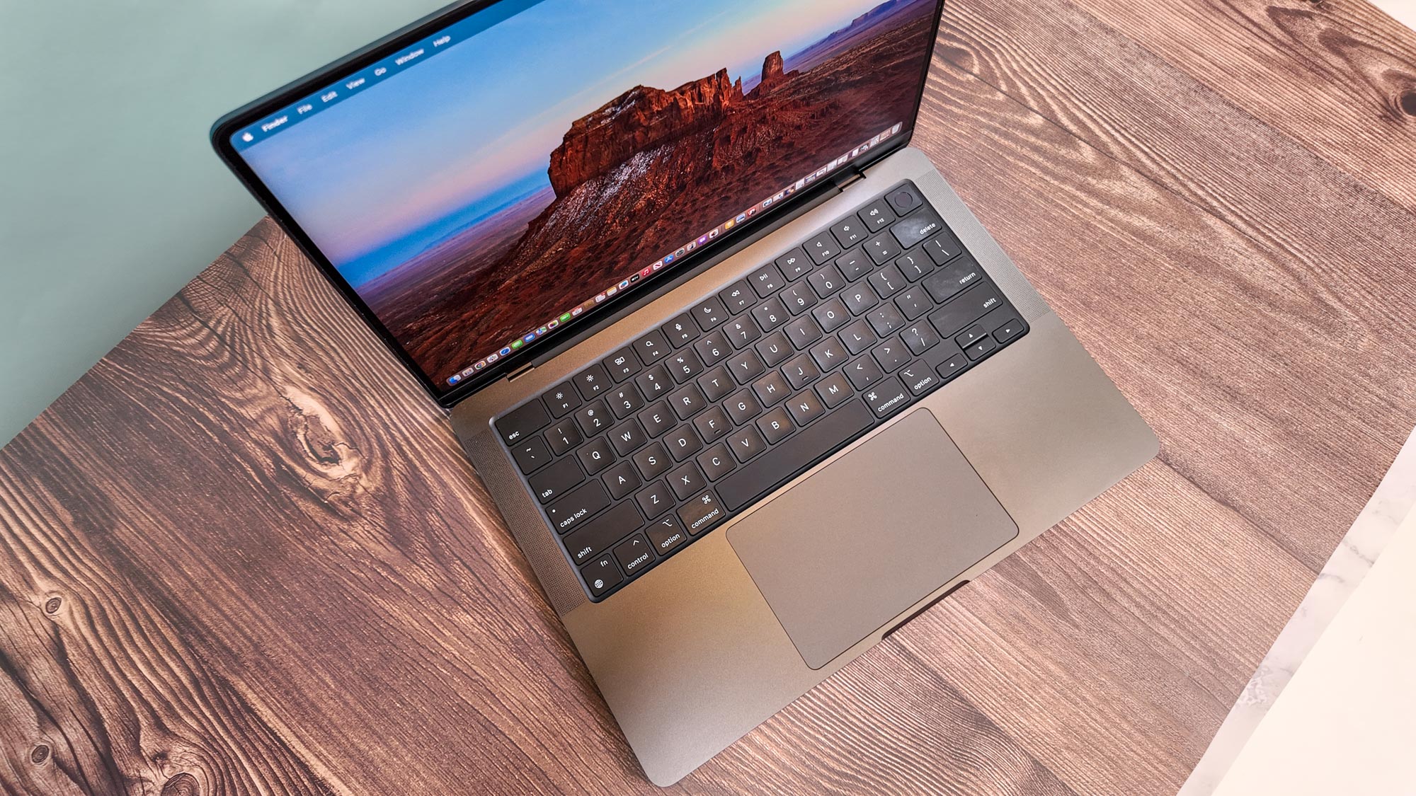 MacBook Pro 14-inch (2024, M4) shown open on a table