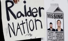 Fans hold signs with photographs of injured Las Vegas Raiders defensive end Maxx Crosby (98) and tight end Brock Bowers (89) before an NFL game against the New York Giants at Allegiant Stadium on Sunday, Dec. 28, 2025, in Las Vegas.