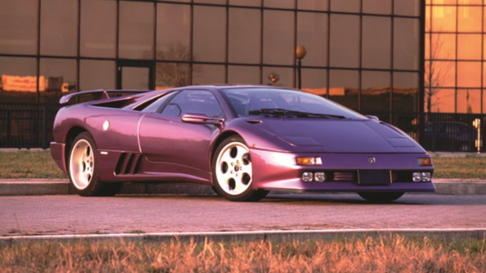 Lamborghini Diablo parked outside a hanger