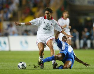AC Milan's Rui Costa battles with Porto's Costinha in the 2003 UEFA Super Cup in Monaco.