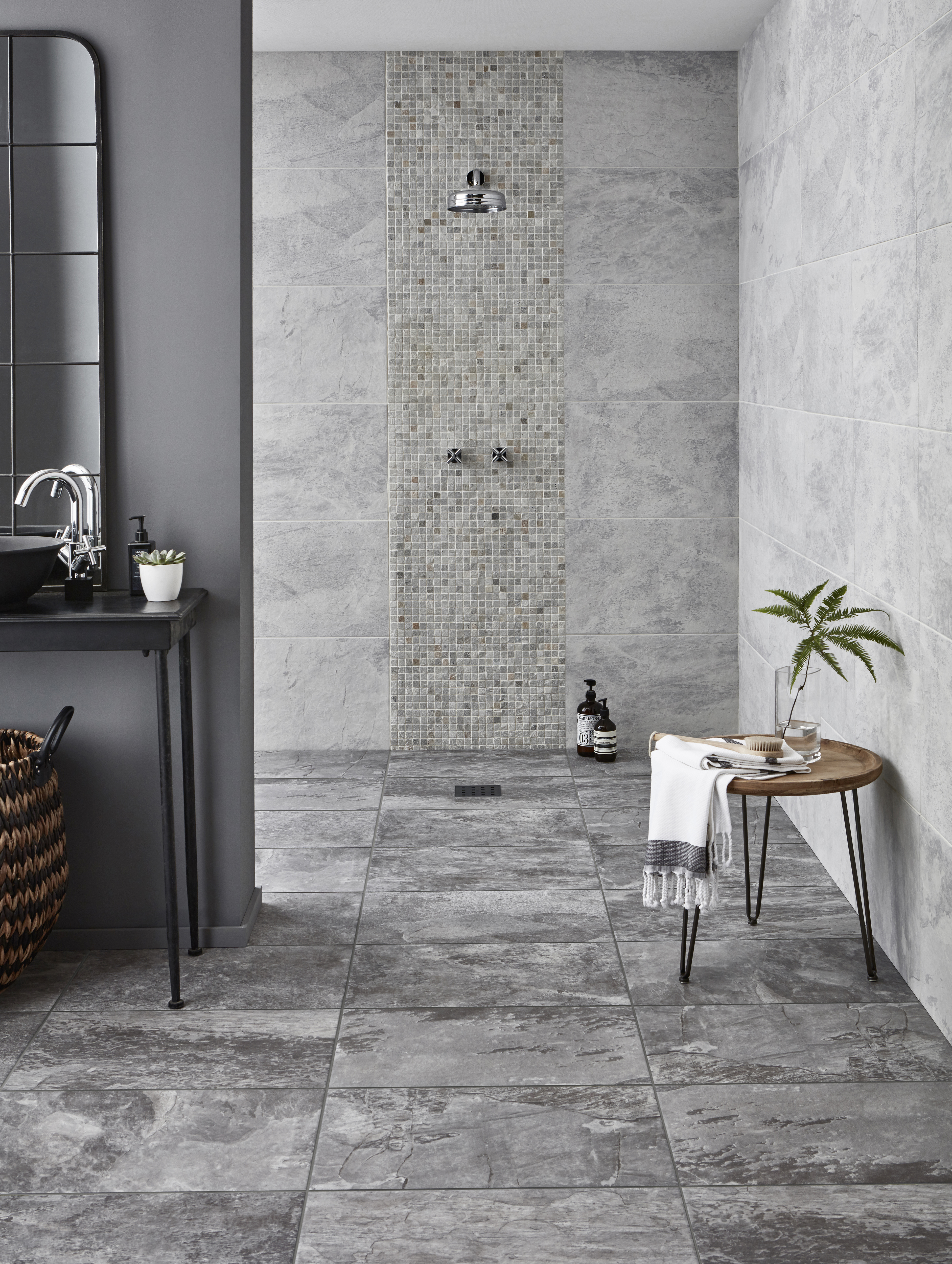 Modern bathroom with open shower and grey tiled finish