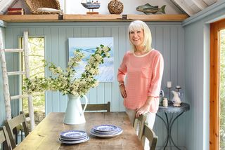 Linda homeowner of a lakeside summerhouse in the dining space
