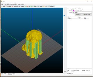 Previewing a model in Slic3r. A good slicer will not only repair any issues with a 3D model, but will also generate needed supports. The green coloring represents the removable supports Slic3r added to the dog model to make for a successful 3D print.