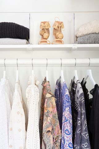 An organized closet with matching hangers