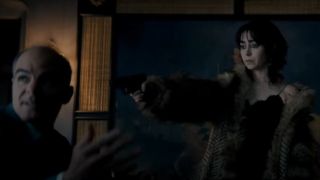 Cristin Milioti pointing a gun at Michael Kelly on The Penguin