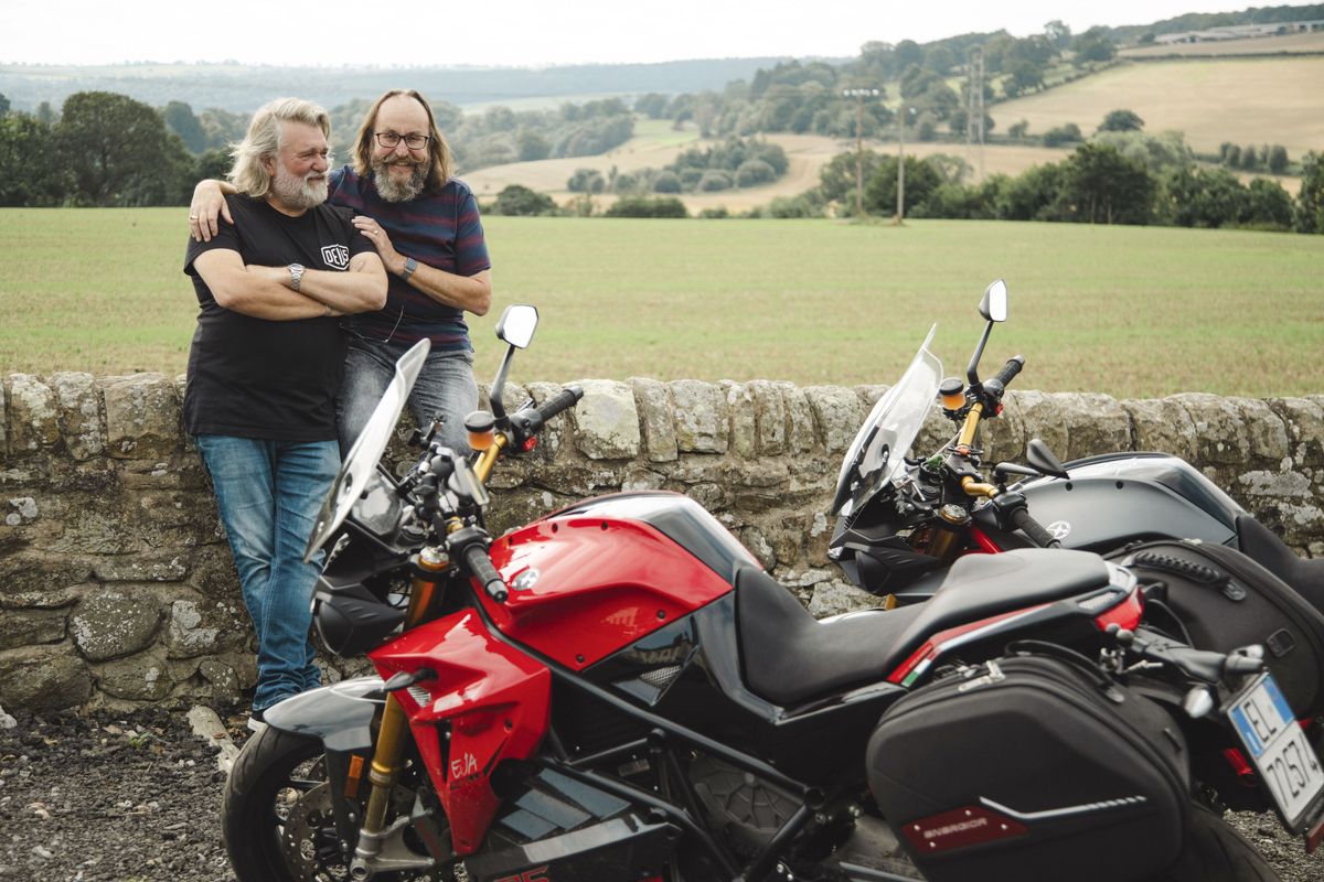 A clip from The Hairy Bikers: You&#039;ll Never Ride Alone showing Si King being hugged by Dave Myers in a countryside stop with their motorcycles in the foreground. 