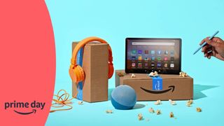 Orange headphones, a fire tablet, and echo dot speak on top on Amazon Prime Day boxes with woman holding a stylus pen against a blue background