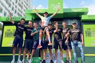 Oscar Sevilla celebrates with his Medellin-EPM team after winning the 2023 Tour of Hainan