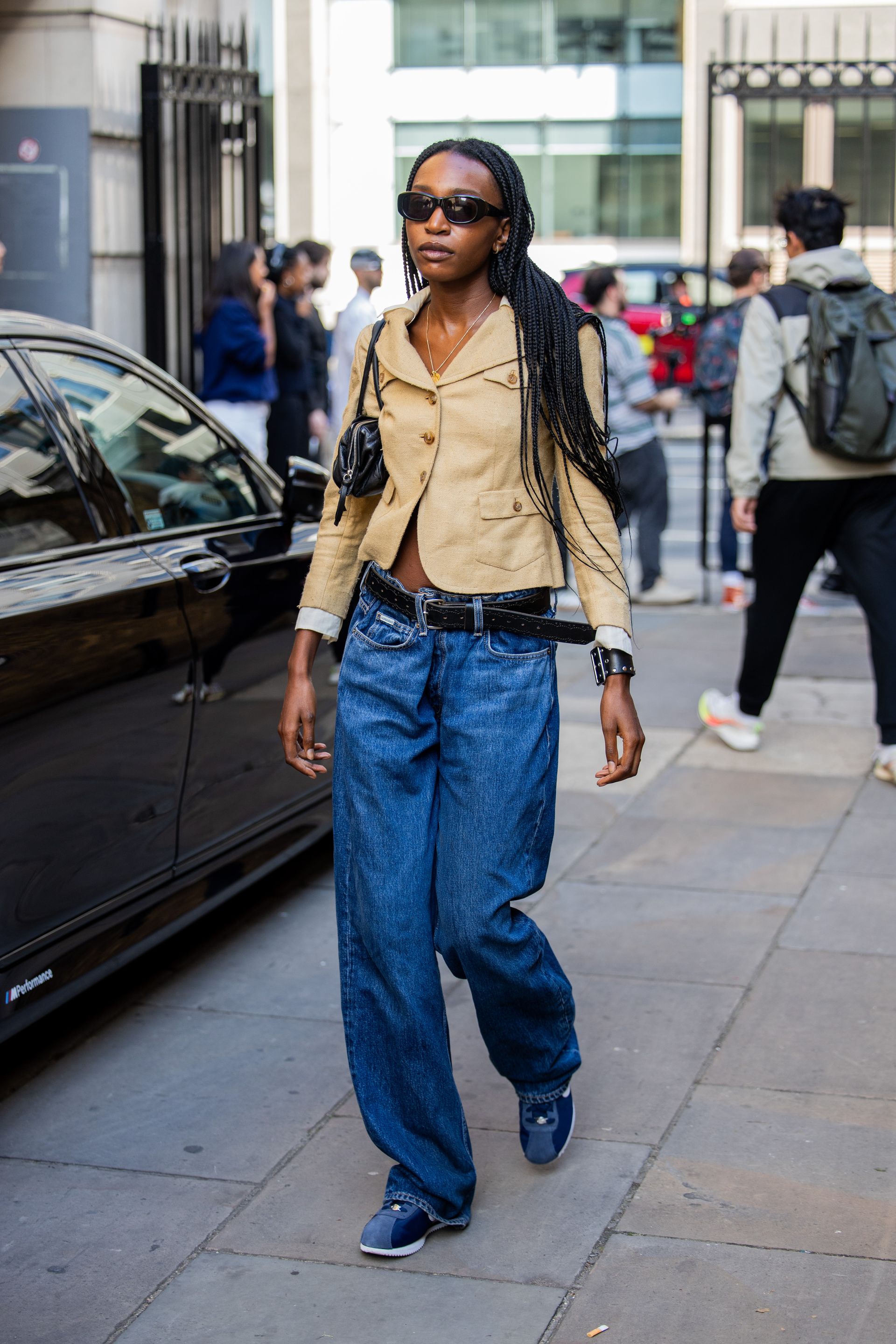 Woman in cropped blazer and jeans