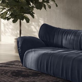 Detail of blue 'Juno' sofa by Iosa Ghini in neutral toned living room