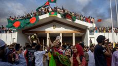 Protesters pose in front of Bangladesh's prime minister residence after longtime leader flees country