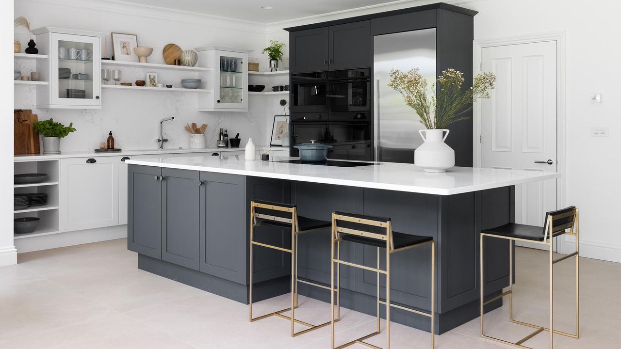 kitchen with bar stools and island unit