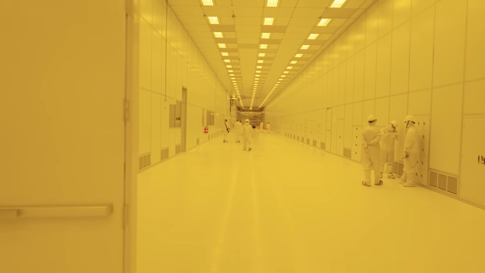 One of the hallways of TSMC Arizona, lit in yellow
