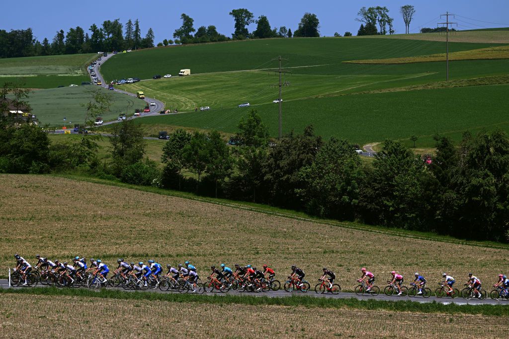 NOTTWIL SWITZERLAND JUNE 12 A general view of the peloton passing through a landscape during the 86th Tour de Suisse 2023 Stage 2 a 1737km stage from Beromnster to Nottwil UCIWT on June 12 2023 in Nottwil Switzerland Photo by Dario BelingheriGetty Images