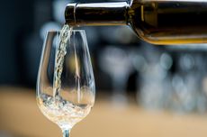 white wine being poured