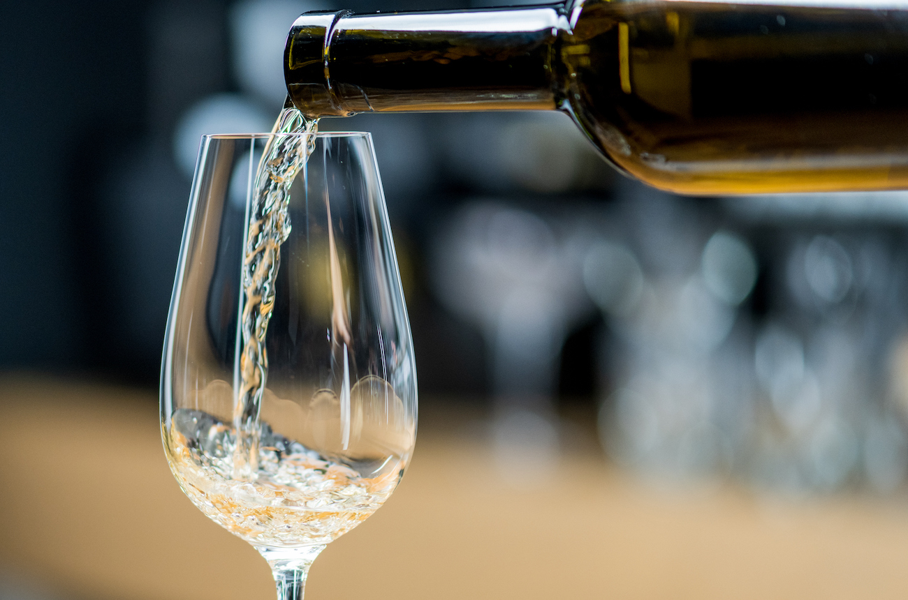 white wine being poured