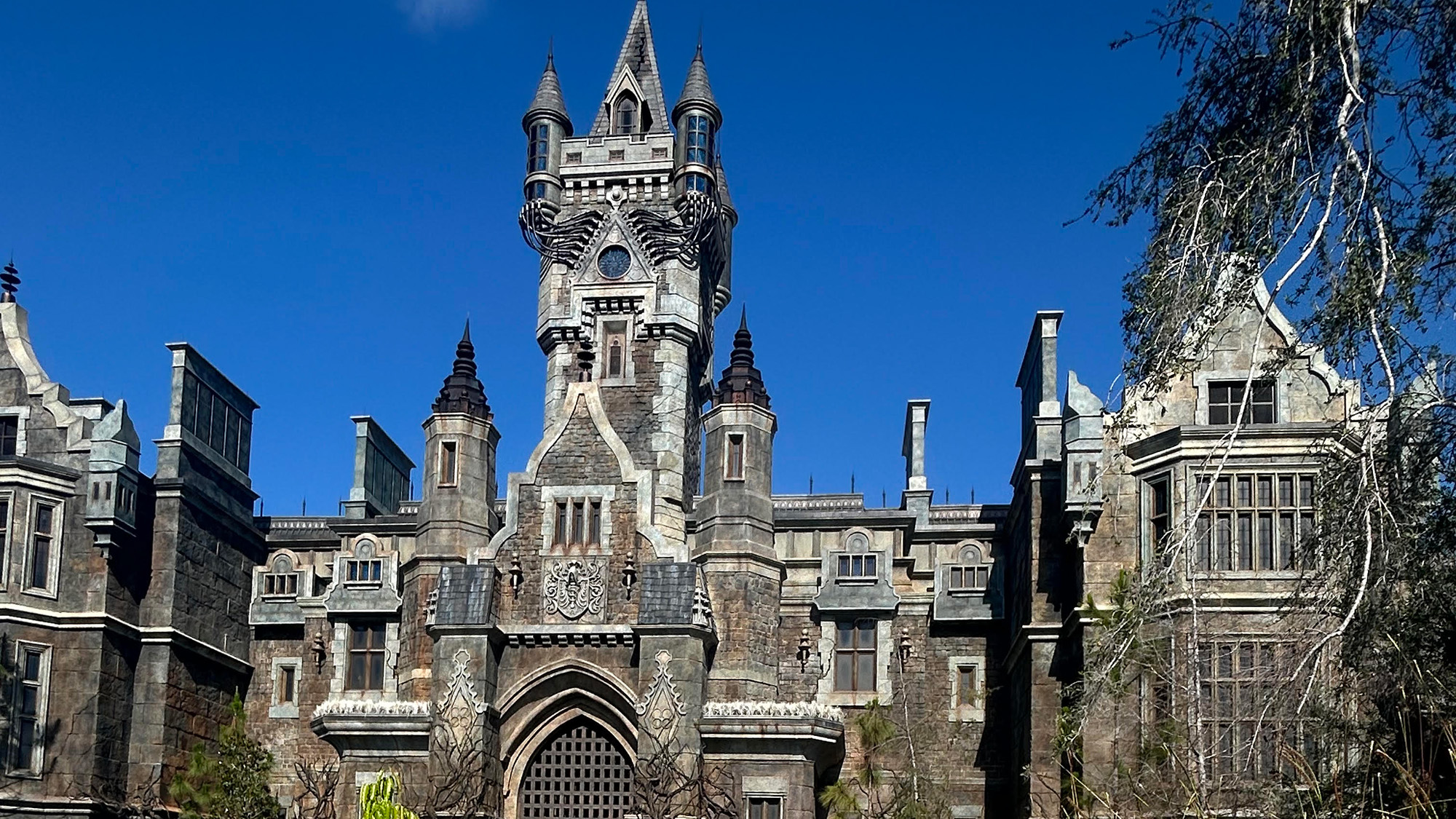 A view of Victoria Frankenstein's Manor at Dark Universe at Epic Universe Universal Orlando in the Daylight. It is gothic. 