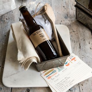 A bottle of beer on a kitchen counter