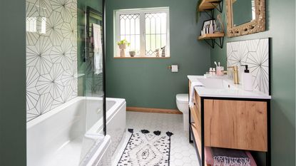 green bathroom with black and white tiles