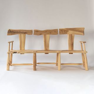 Wooden bench with three backrests