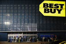 Customers wait in line to shop Best Buy Black Friday deals.