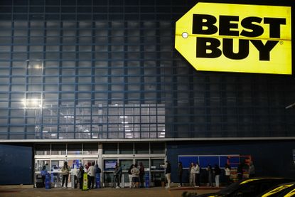 Customers wait in line to shop Best Buy Black Friday deals.