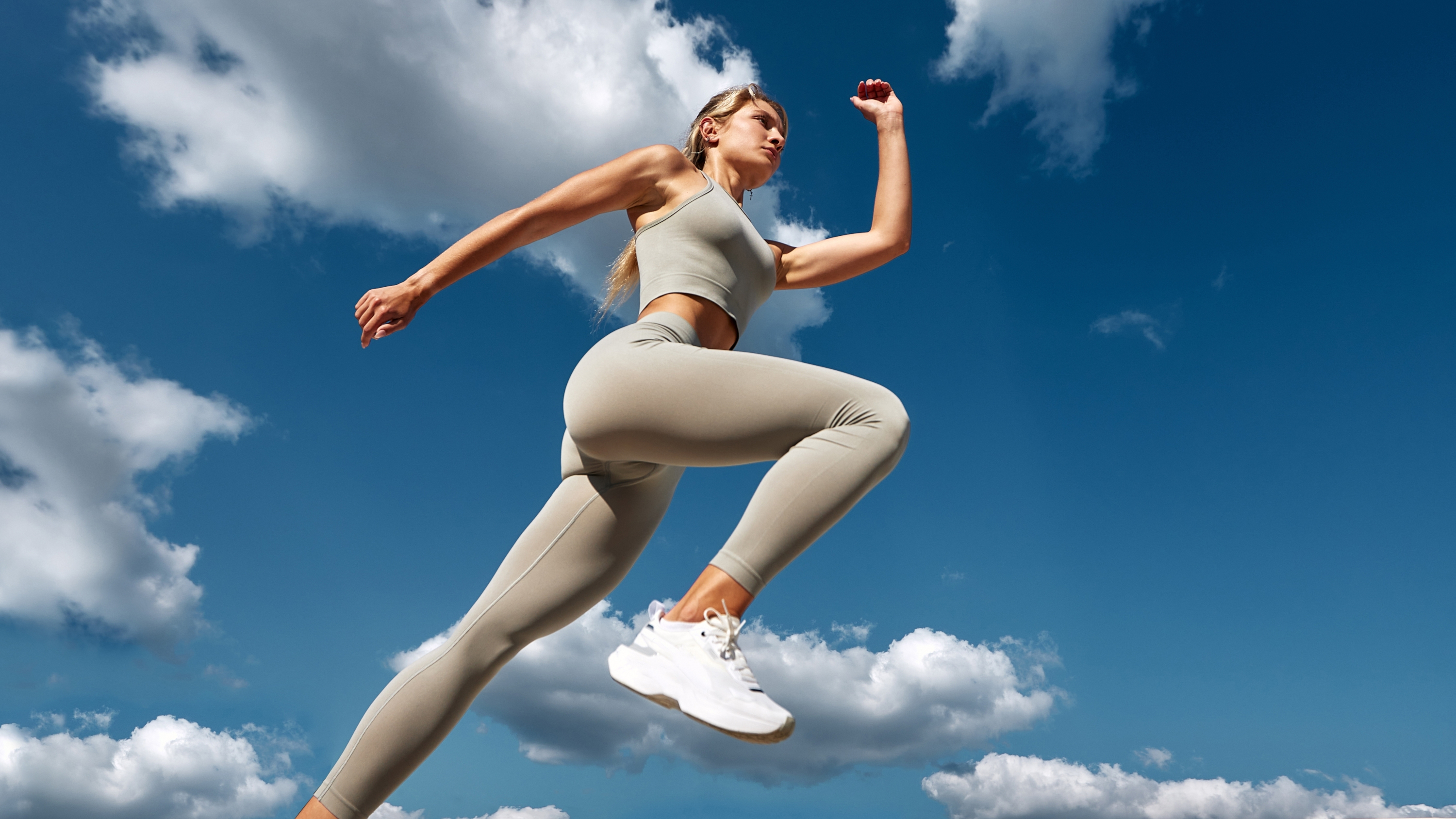 a female runner taking a strong stride 