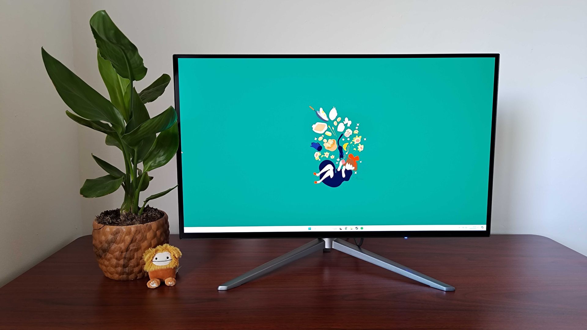KTC G27P6 on desk with Windows 11 on screen and Kiki's Delivery Service abstract wallpaper